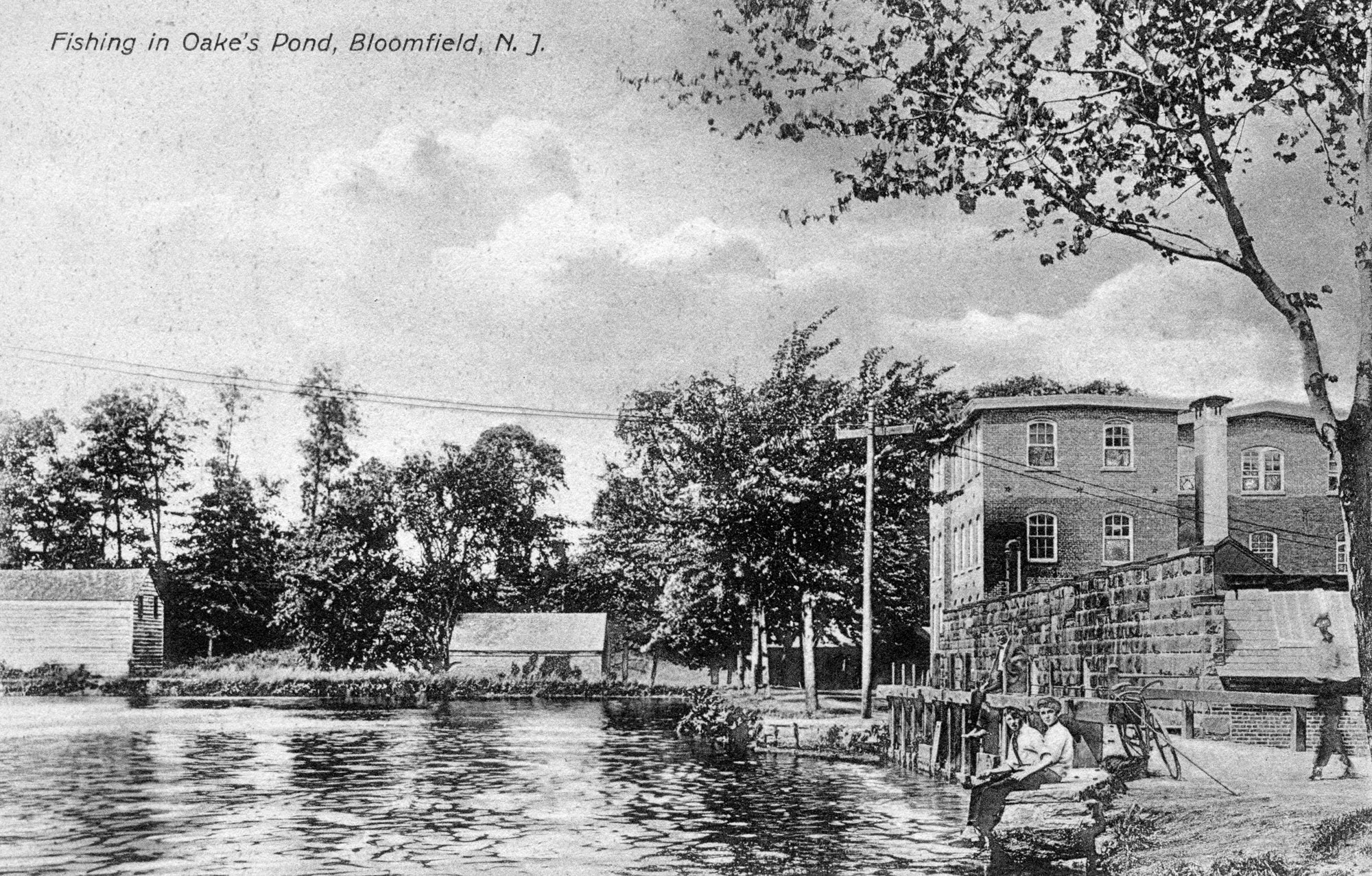Postcard photo of boys fishing at Oakes Pond